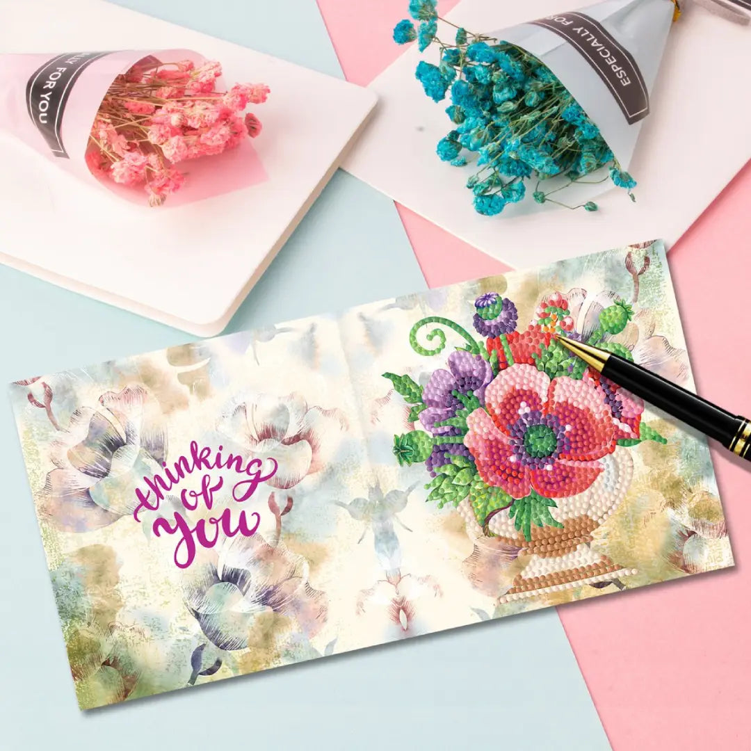 Diamond painting wenskaart met de tekst 'Thinking of you' en een bloemenboeket met pioenrozen.