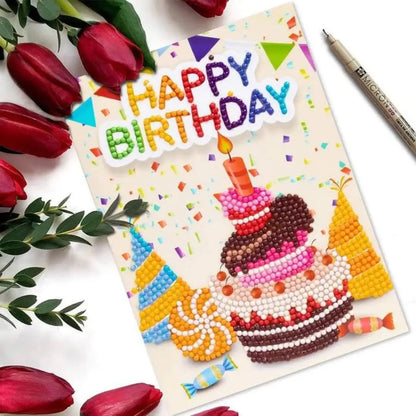 Diamond painting verjaardagskaart met een taart en de tekst 'Happy Birthday', omringd door rode tulpen